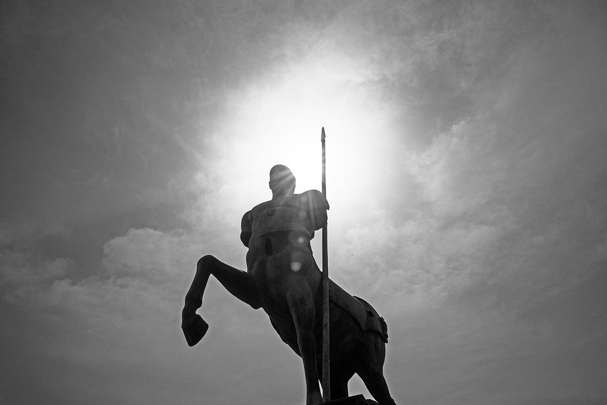 The silhouette of a statue of a Centaur.